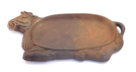 A continental early 20thC cast iron cold meat dish, modeled as a recumbent bull, stamped W K M 2, 30cm wide.