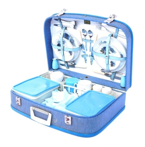 A 1960's cased Brexton picnic hamper, with tupperware and ceramic plates, in blue outer casing, 40cm high, 53cm wide.