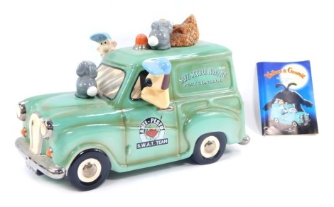 A Wallace and Gromit Border Fine Arts cased van money box, boxed.