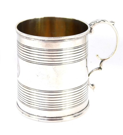 A Victorian silver tankard, with ribbed detail and central circular buckle bearing the initials ELP, and acanthus leaf handle, London 1867, 4oz.