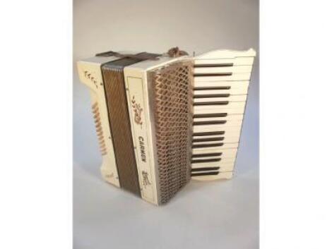 A Carmen piano accordion in case