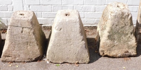 Three staddle bases, each of pyramid form, 41cm high.