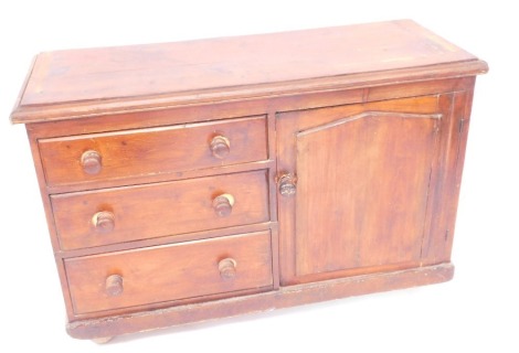 An early 20thC pine Lincolnshire dresser, with arrangement of three drawers and one cupboard door, on a block base with applied castors, 80cm high, 120cm wide, 47cm deep.