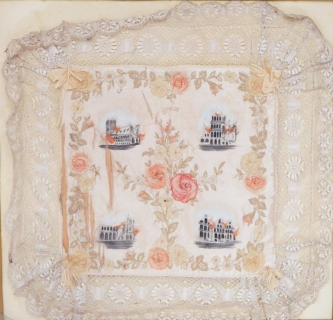 A silk embroidery, the central square set panel with raised rose relief and painted buildings, bearing the inscription ZJPRES, 72cm x 70cm, framed. (AF)