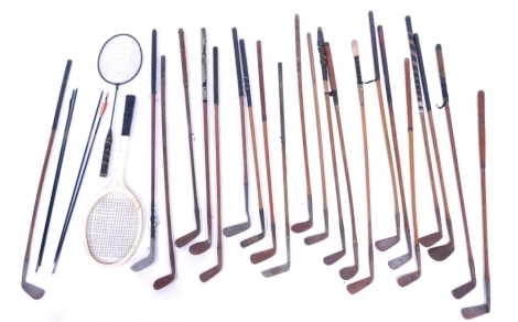 A collection of early 20thC hickory shafted and other golf clubs, tennis racquet, arrows, etc. (a quantity)