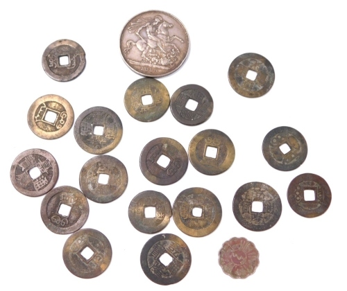 A group of coins, comprising a £5 silver crown 1889 and a group of oriental coins, with square cut marks to centre.