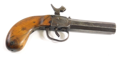 A 19thC percussion boxlock pistol, with plain barrel and walnut handle, 19cm long.