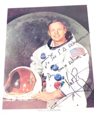 Neil Armstrong interest. A colour photograph signed to Sgt ST Wayling Good Wishes Neil Armstrong, in black pen, 24cm x 19cm, with hand typed letter from Elaine Moore secretary dated December 5th 1979 and other related ephemera.