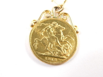 A George V gold half sovereign, 1918, soldered mount attached to slender link chain, 40cm long, 11.6g all in. - 2