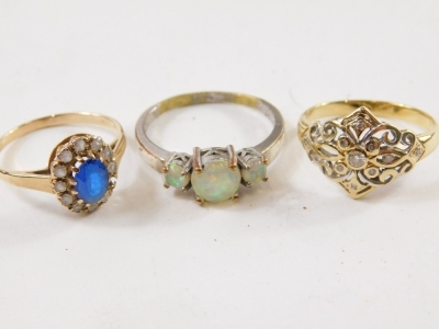 A 9ct gold dress ring, florally set with blue claw set stones surround by small white stones, part pierced shank, size P-Q, two further dress rings. (3) - 2