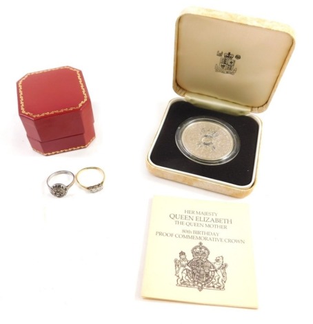 An 18ct gold solitaire ring, illusion set with small white stones, size K, an illusion set three stone ring, further dress ring, small quantity of coins, Queen Elizabeth the Queen Mother 80th birthday crown. (a quantity)