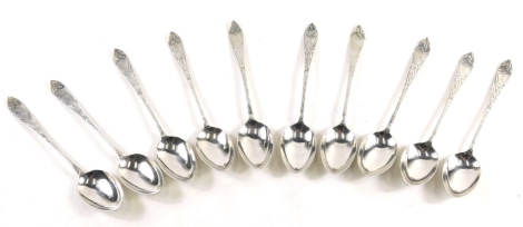 A set of ten George V Art Nouveau Scottish silver teaspoons, by John Alexander Fettes, with shaped etched handles, Glasgow, 1912, 12cm long, 3.75oz. (10)