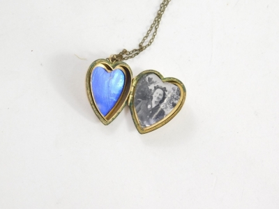 A 9ct gold heart shaped locket, 2cm high, 5.7g, attached to a plated slender link chain, a flapper style necklace and a gold plated bracelet. (a quantity) - 2