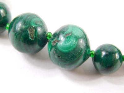 A graduated malachite bead necklace, with beads 6cm diameter, etc., on a plain string, 46cm long. - 2