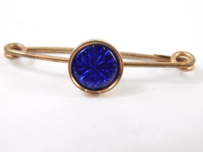 An 20thC pin brooch, centred with a circular blue section on a gold mount, with plated pin back, 5cm wide. - 2