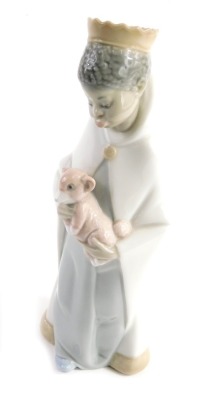 A Lladro figure of a boy king holding monkey, C175, marked beneath, 20cm high.