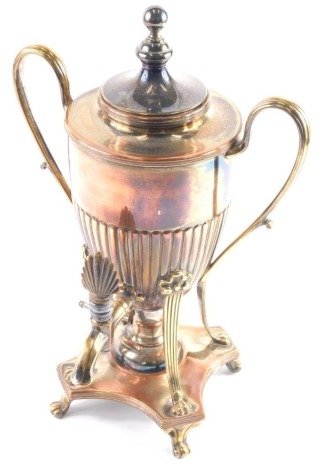 A late 19thC samovar, with front tap, and part fluted body, with shell handle and burner beneath on scroll feet, 34cm high.