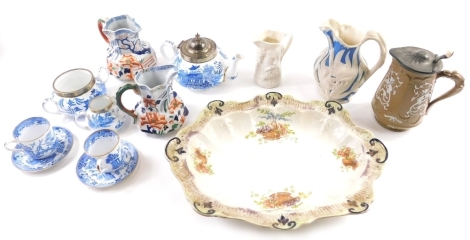 Various 19thC and other pottery and effects, a pair of graduated stoneware jugs, blue and white Copeland part service, serving dish, jug raised with flowers, etc. (a quantity various dimensions)