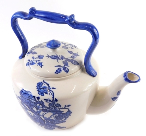 A large pottery kettle, transfer printed with blue and white flowers, printed mark stated Victoria Ironstone Staffordshire England, 35cm high.