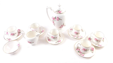 A Coalport floral patterned coffee service, to include coffee pot, 21cm high, coffee cans, sugar bowl, etc., settings for six, printed marks beneath. (a quantity)