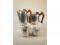 A four piece Picquot ware stainless steel tea set comprising of hot water jug