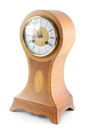 An Edwardian style Sheraton revival balloon mantel clock, with 11cm diameter Roman numeric dial with shell printed patera and eight day movement 35cm high.