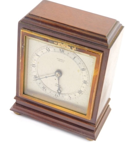 A W Mansell Lincoln mantel clock, with 9cm diameter Roman numeric chapter ring and Elliott London movement, in a stepped mahogany case, on compressed bun feet, 17cm high.