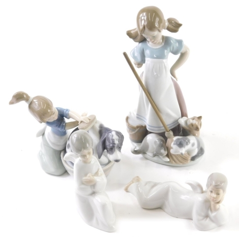 A Lladro figure of a girl holding broom, and another washing puppy, printed marks beneath and other Nao figures. (a quantity, AF)