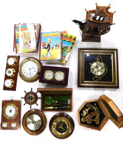 A ship's style clock, with brass front, 20cm diameter, two others, box with anchor emblem, reproduction three dial barometer clock, ship's wheel clock, electric lamp in the form of a ship, cased magnifying glass and knife clock, small cuckoo clock, etc. (