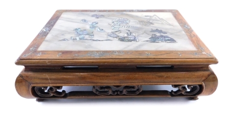 A Japanese rosewood plant stand, of rectangular form, set with a mother of pearl and marble finish centre section, with an outer mother of pearl floral decoration, on heavily carved scroll base terminating in compressed square stepped feet, 11cm high, 32c