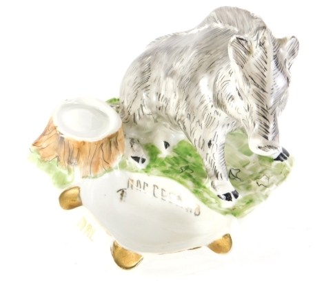 A 20thC Ukrainian porcelain boar ashtray, polychrome decorated in grey and green with gilt highlights, 13cm high.