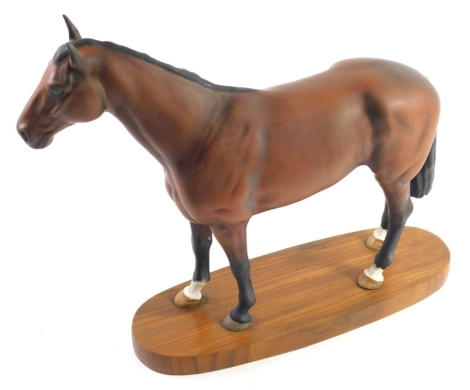 A Beswick horse Nijinsky, on wooden plinth base, marks beneath, 30cm high.