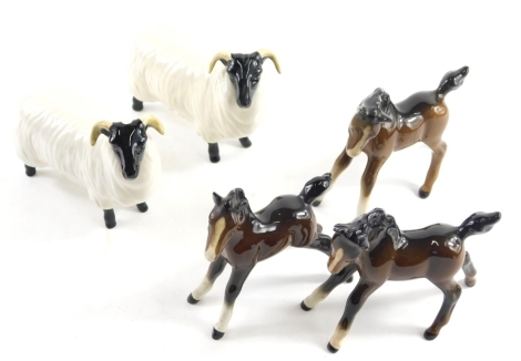 Various Beswick foals, and two black faced sheep. (a quantity)