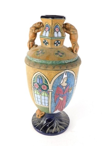 An Austrian Amphora vase, decorated with medieval style figures, lion masks, with cover. (AF)