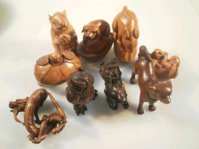 Nine carved wood netsuke and inros