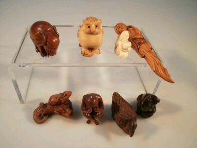 Six hardwood netsuke and two resin netsukes