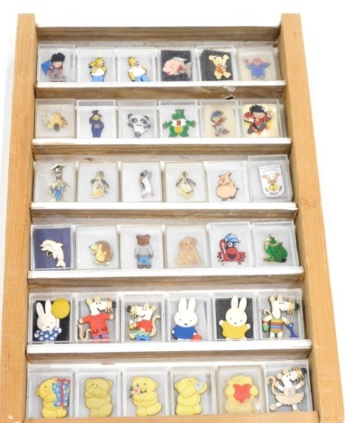 Various enamel and other badges, to include Homer Simpson 3cm high, penguin, etc. (1 case)