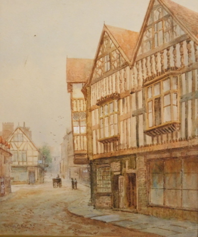 •Arthur Bell (1897-1995). Street scene, Tudor houses, figures in horse and cart, watercolour, signed, 31cm x 23cm.