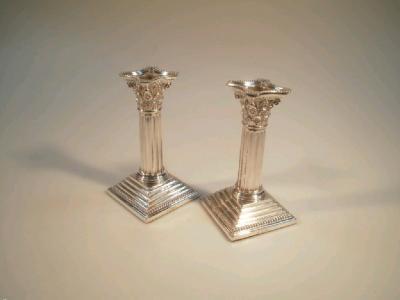 A pair of Edward VII silver composite candlesticks by Walker Latham & Son