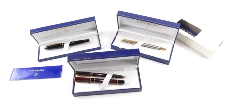 Various pens, Waterman black with gilt coloured banding and clip, in fitted case, a cased pen set and another in case and outer box.