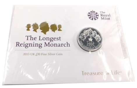 A Royal Mint Treasure For Life Longest Reigning Monarch twenty pound fine silver coin, with outer packaging.