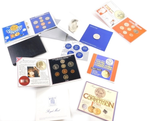 Various coins, etc., The Millennium Coin minted at The Dome, United Kingdom uncirculated coin set 1985, another 1984 and 1983, each in outer card packaging. (a quantity)