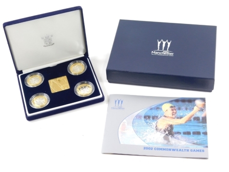 A Royal Mint Manchester 2002 Commonwealth Games four coin set, with paperwork, case and outer box.