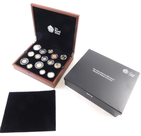 A Royal Mint 2014 United Kingdom premium proof coin set, paperwork, box and outer packaging.