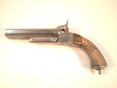 A 19thC double barrelled percussion pistol