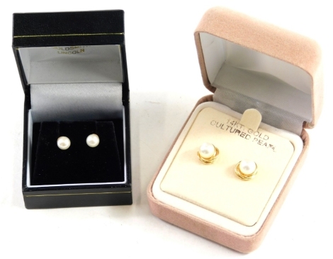 A pair of 14k backed pearl ear studs, and another pair of studs. (2 boxed)