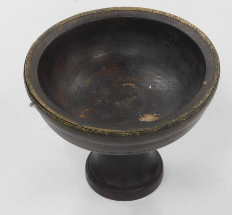 A treen font shaped bowl, with metal banding, on shaped stem and circular foot, 25cm high, 32cm diameter.