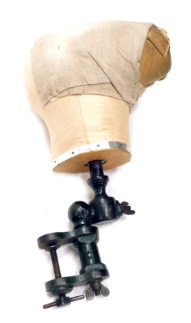 An early 20thC articulated hat maker's stand dummy head, with metal articulated stem with metal banding and material head shaped top, 47cm high.