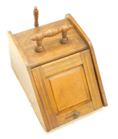 An oak coal box, with turned handle, removable shovel and lead lined interior, 30cm high, 35cm wide, 43cm deep.