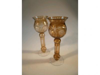 A pair of ruby wash candle holders